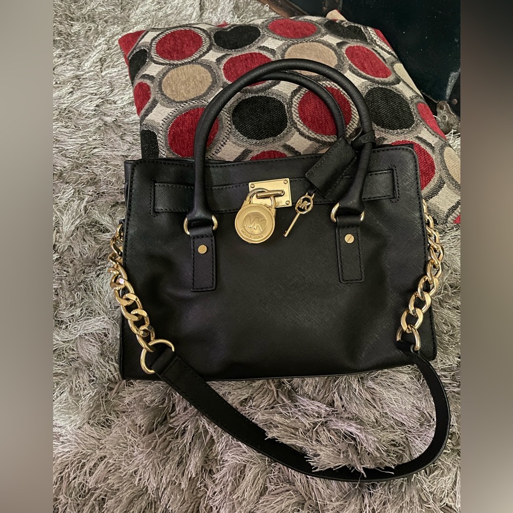 Michael Kors Medium Messenger bag. Black with gold lock and hardware